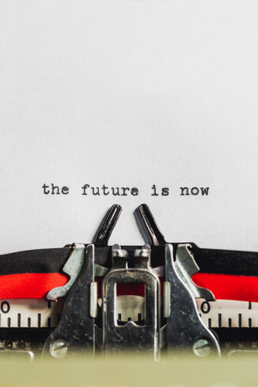 text on typewriter states the future is now