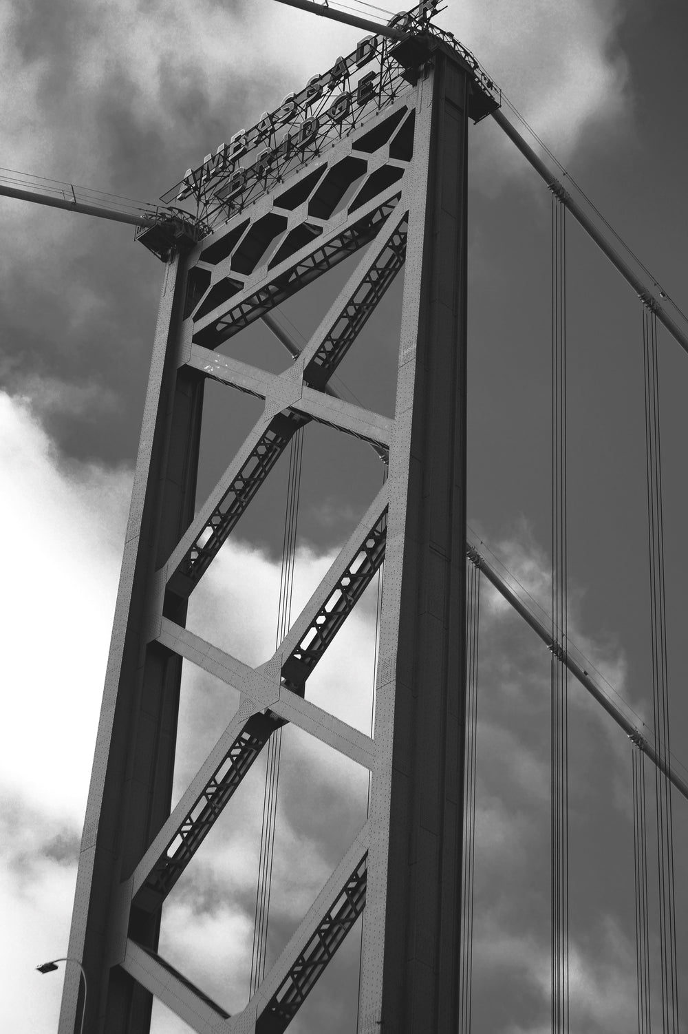 the ambassador bridge viewed below in black and white