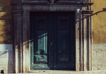 the door of a historical building catching the light