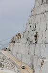 the edge of a quarry with white rocks