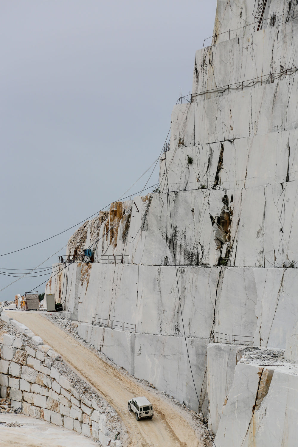 the edge of a quarry with white rocks