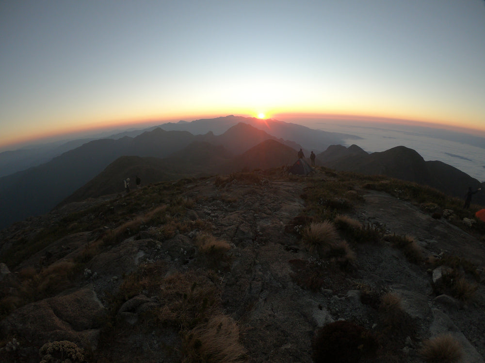 the first light of day over a mountain range