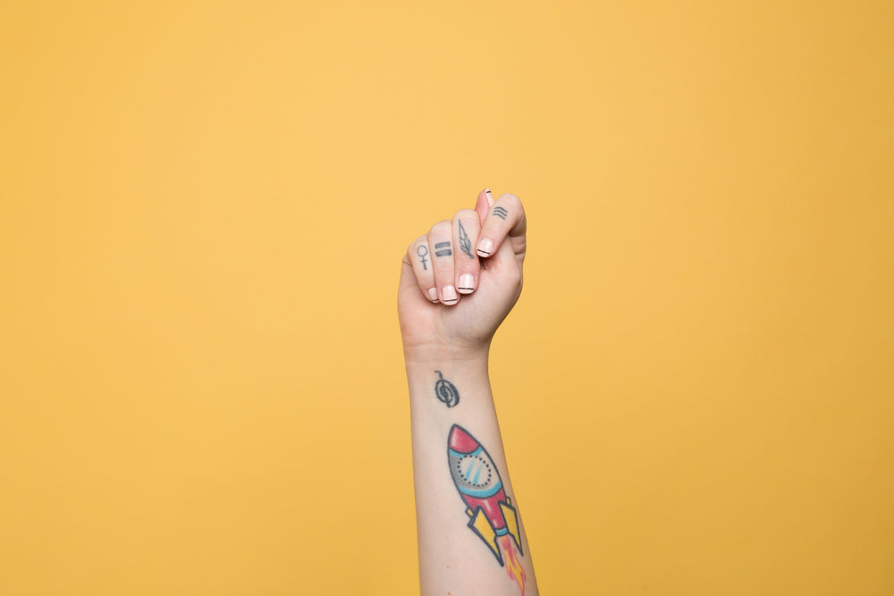 the letter "t" displayed in american sign language