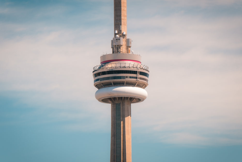 the middle of the cn tower against a blue sky