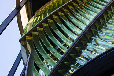 the panes of glass in a lighthouse lamp reflect sunlight