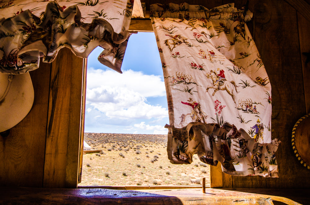 the plains of the wild west seen from a caravan window