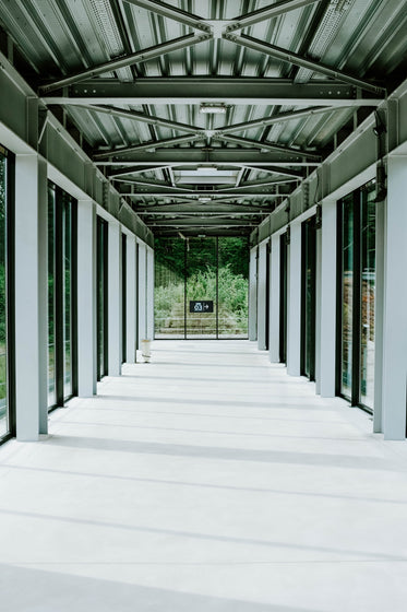 the steel-frame corridor of an airport