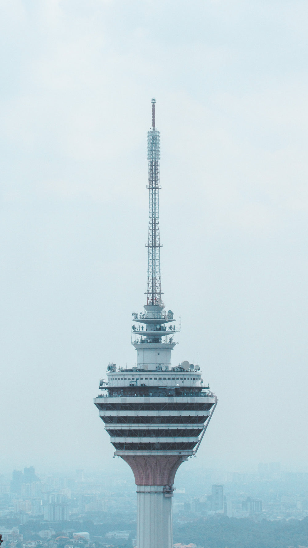 the top of a skyscraper that sits above a city