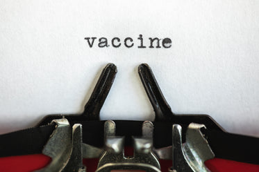 the words vaccine on a typewriter