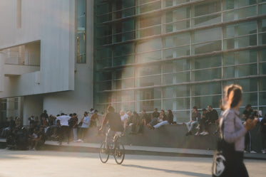 thirty-seven people sitting on a wall