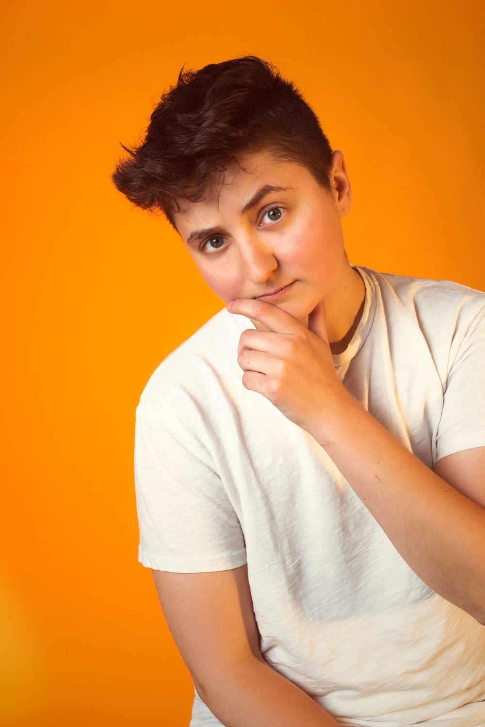 thoughtful person in white tshirt portrait