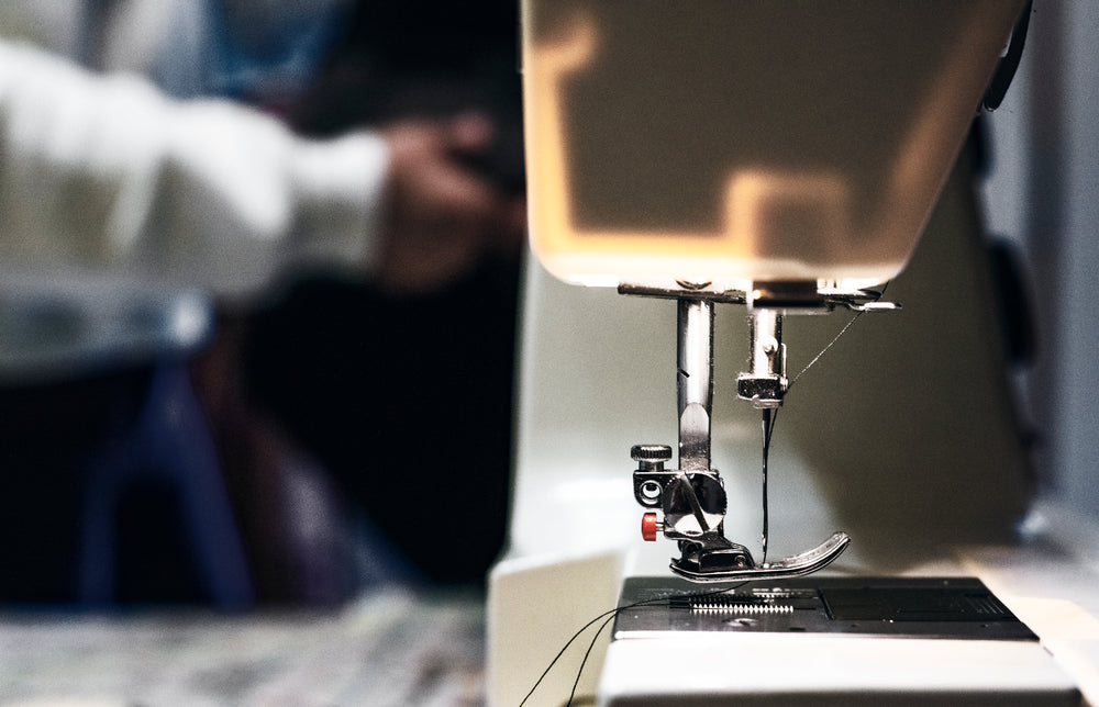 threaded needle on sewing machine