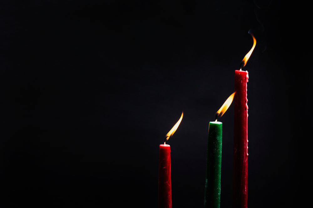 three christmas candles lit