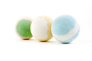 three colorful bath bombs