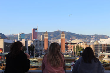 three friends look out over city