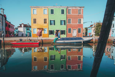 three matching yellow green and red buildings