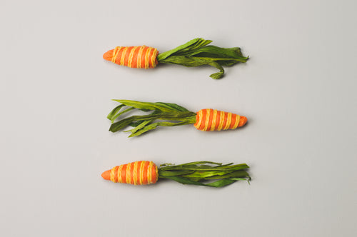 three paper woven carrots