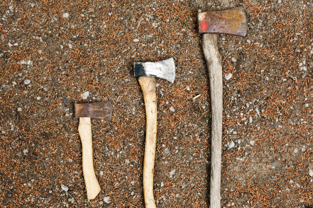 three sizes of axe or hatchet