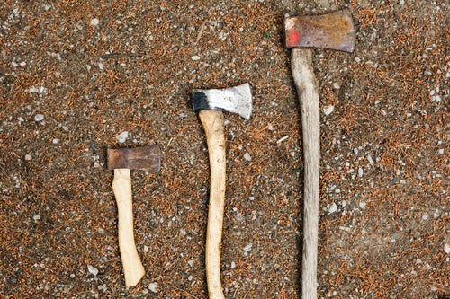 three sizes of axe or hatchet