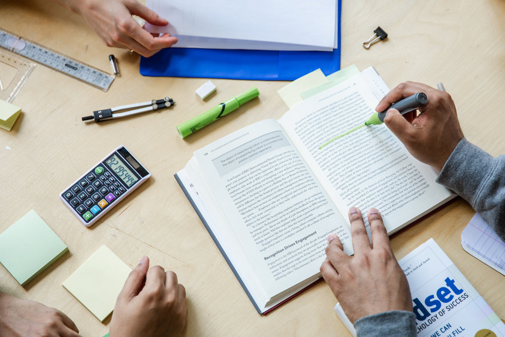 three students working flatlay