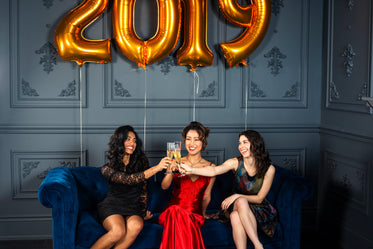 three woman toast to the new year