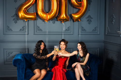 three woman toast to the new year