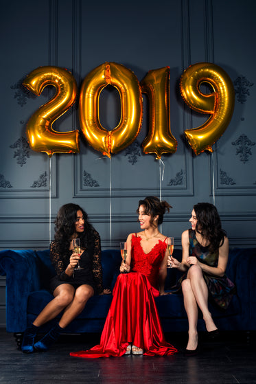 three women in formalwear discuss the year ahead