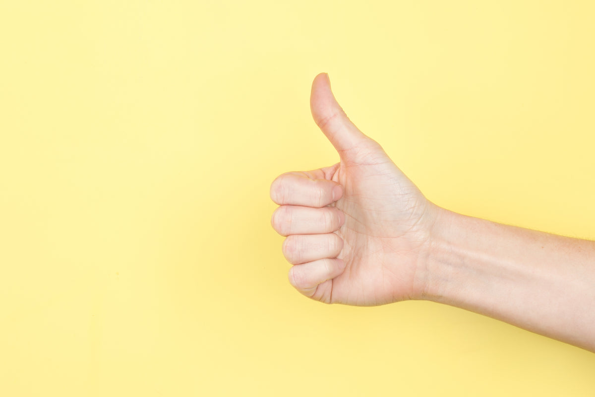 thumbs up on yellow