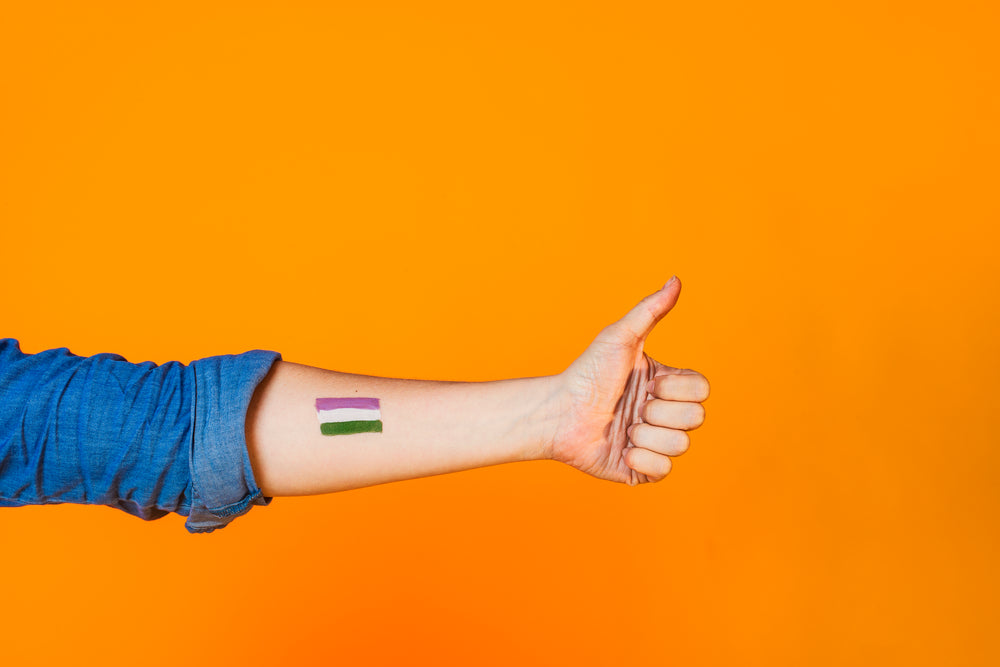 thumbs up with genderqueer flag paint
