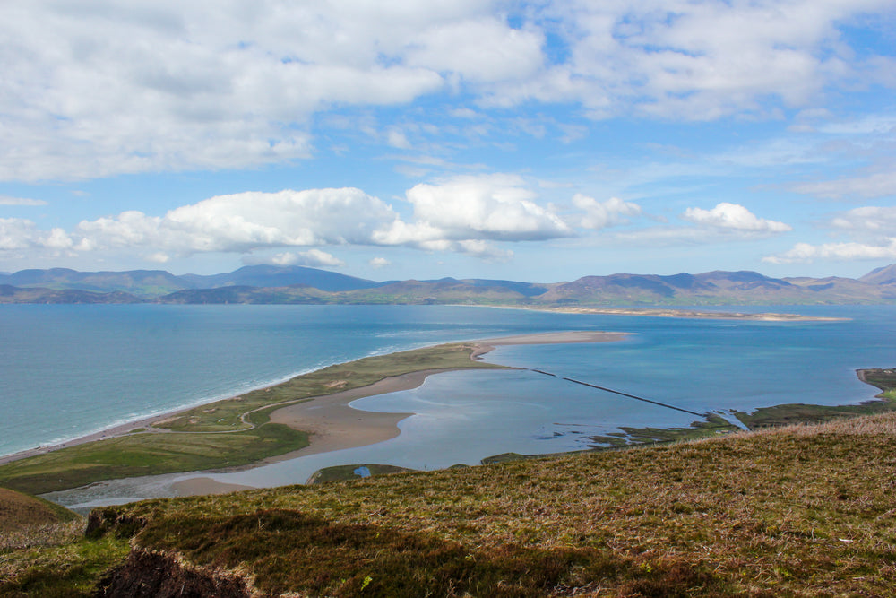 tide rolls out from sandbar on pristine irish coastline