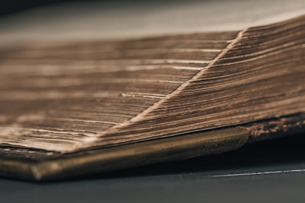 tiered pages of leatherbound book