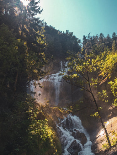 tiered waterfall on clear summer day