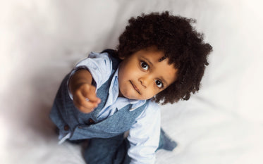 toddler reaches for camera