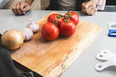 tomatoes & garlic on cutting board