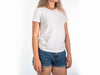 torso of a person wearing white shirt product mockup
