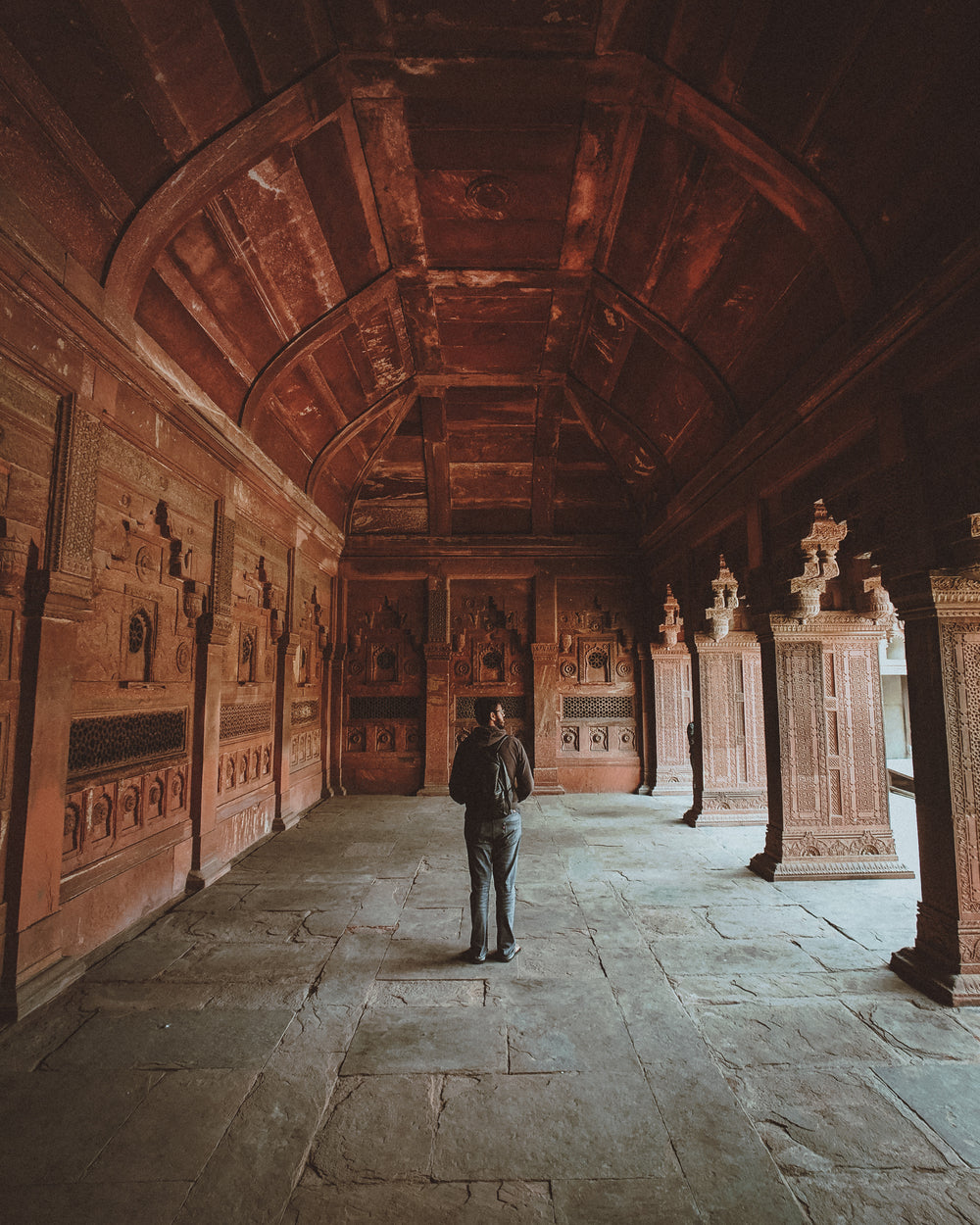 tourist in a buddhist monastery taking it all in