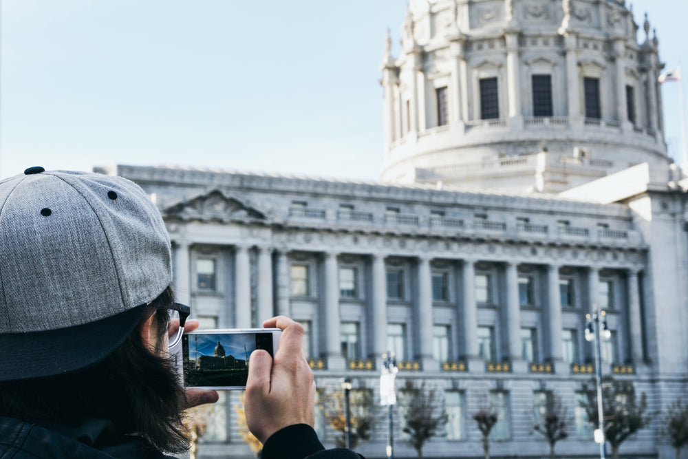 tourist taking cellphone photo