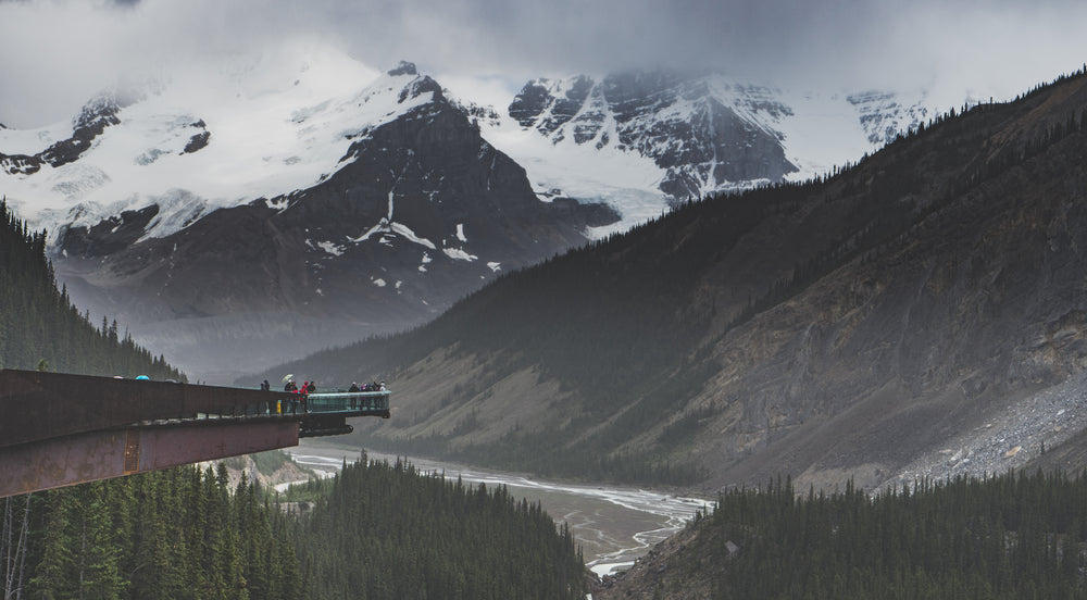 tourists take in the mountainous view