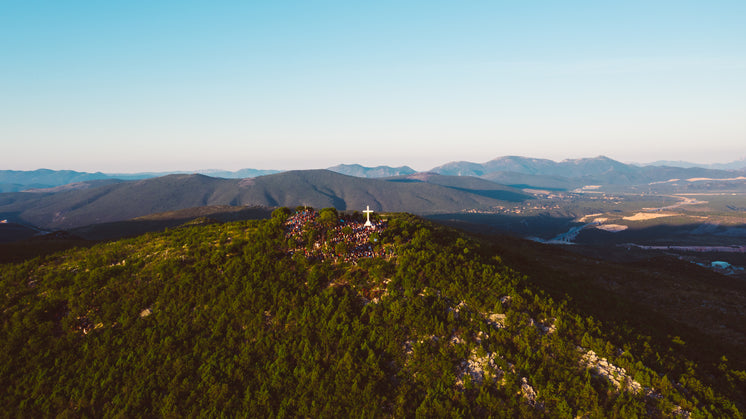 tourists-visit-a-large-cross-stood-at-a-