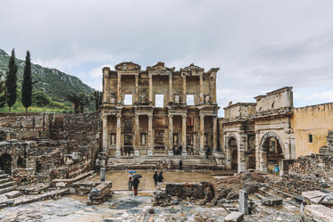 tourists wander around ruins