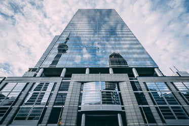 tower reflected in mirrored architecture