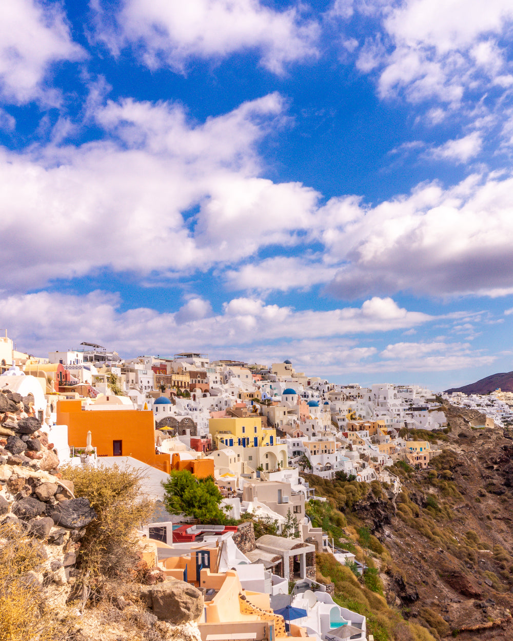 town of colorful homes on a hillside