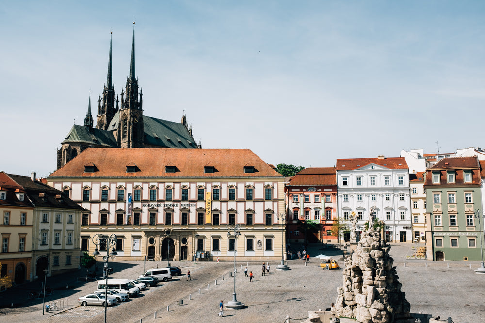 town square with church roof peaking over the building