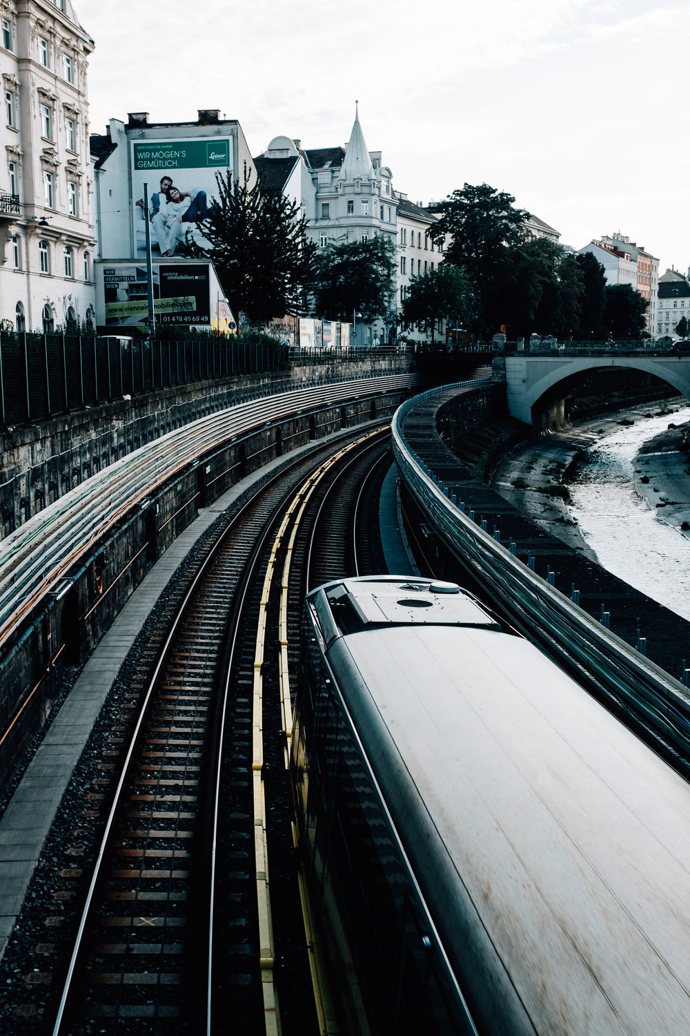 train leaves the station by river