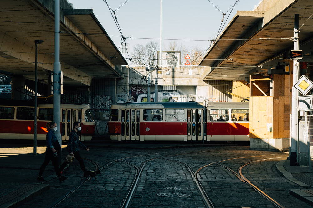 train travels across the frame with tracks and wires