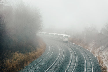 train turning through fog