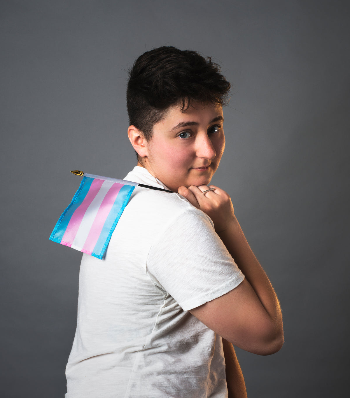 transgender man portrait with trans pride flag