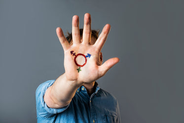 transgender pride symbol painted on hand