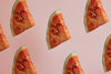 triangle slices of watermelon on pink background