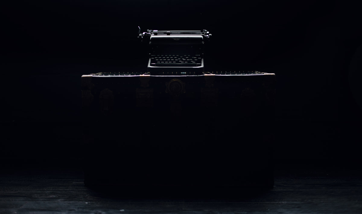 trunk and typewriter in the dark